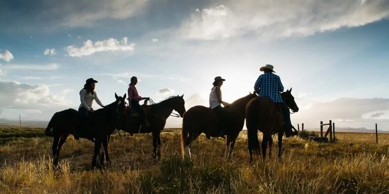 Rider on horseback overlooking Cottonwood Ranch valley