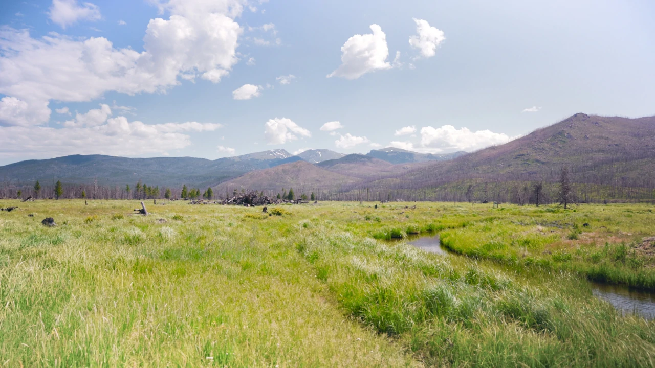 Colorado Headwaters Ranch lake and peaks