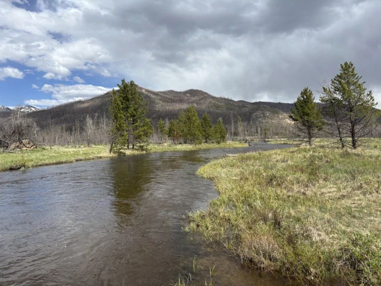 Ranch lake with scenic mountain view