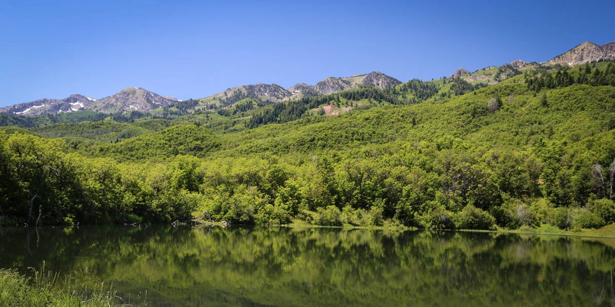 Mountain landscape reflected in alpine lake, Wasatch Range