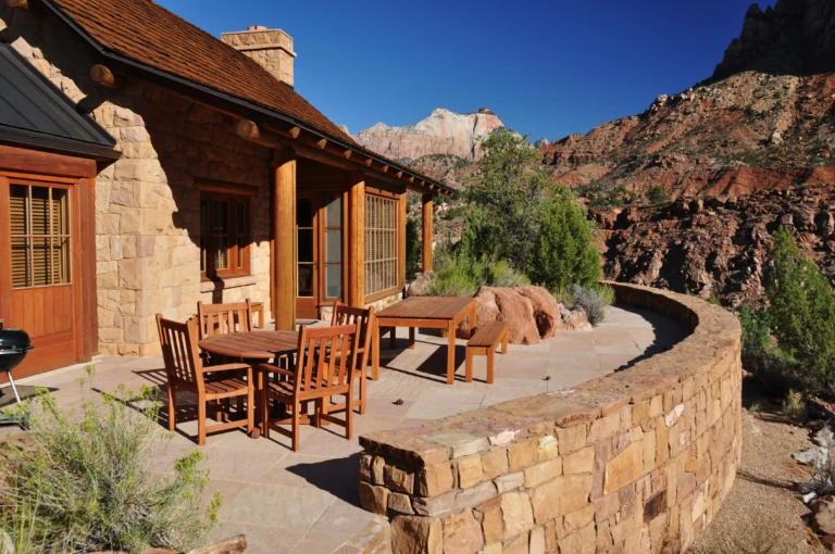 Trees Ranch home with red cliffs | Mirr Ranch Group